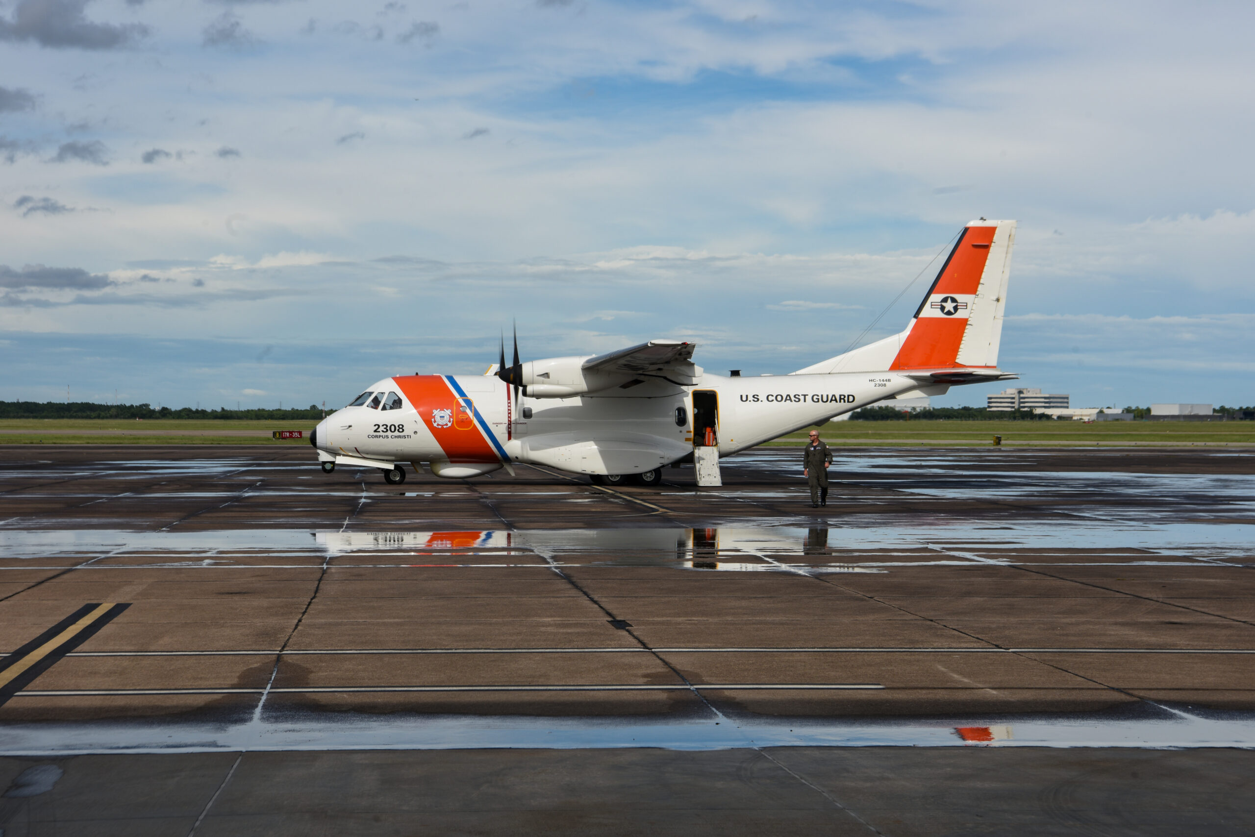 U.S. Coast Guard Lt. Kyle Unger, assigned to Coast Guard Air Station Corpus Christi, deplanes an HC-144 Ocean Sentry in Houston, Texas, July 8, 2024. Air Station Corpus Christi conducted fly-overs of the Texas coastline after Hurricane Beryl. (U.S. Coast Guard photo Petty Officer 2nd Class Jessica Fontenette)