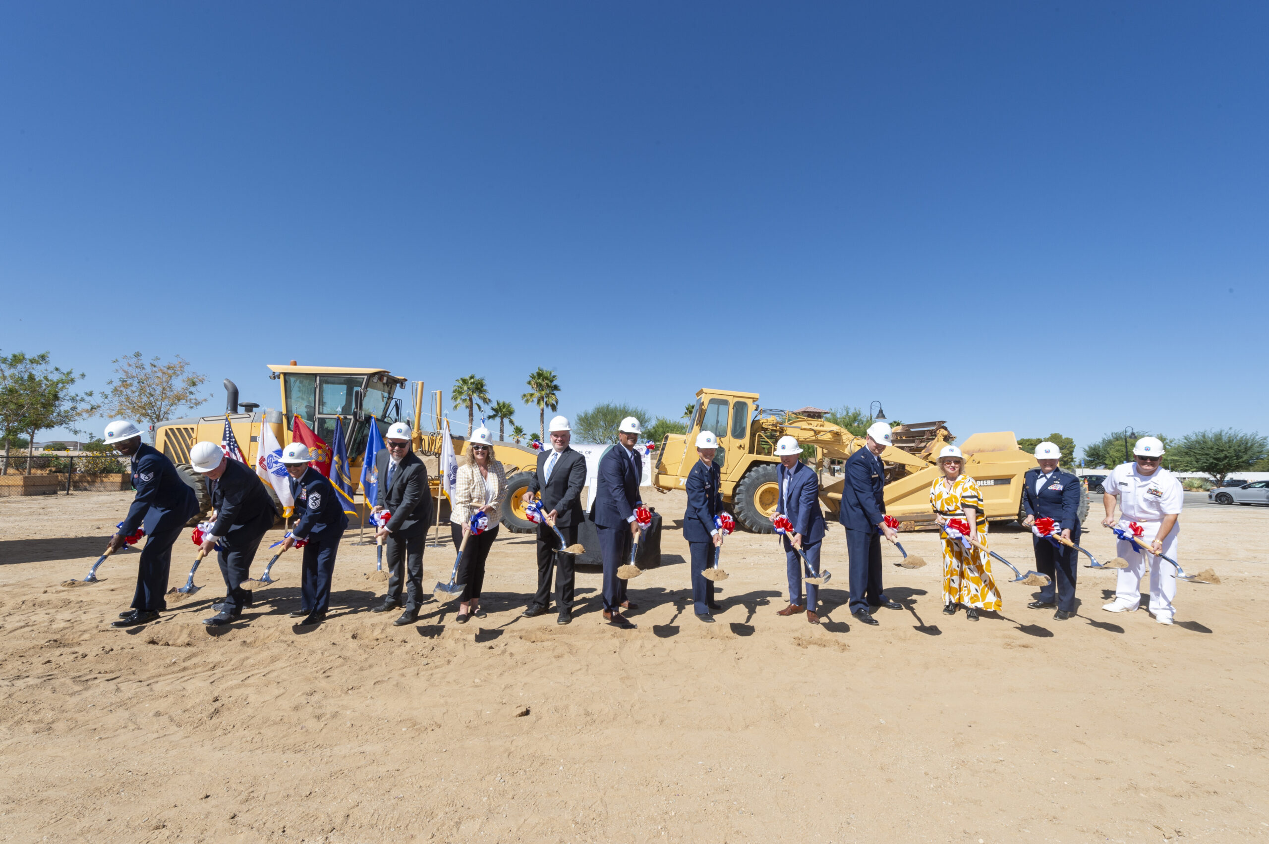 Base leaders, prospective tenants, mission partners and other senior officials break ground on a commercial apartment complex on Edwards Air Force Base, California, Sept. 10. (Air Force photo by Chloe Bonaccorsi)