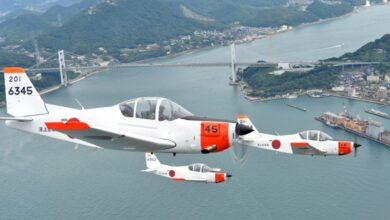 Three Fuji T-5 trainers in flight