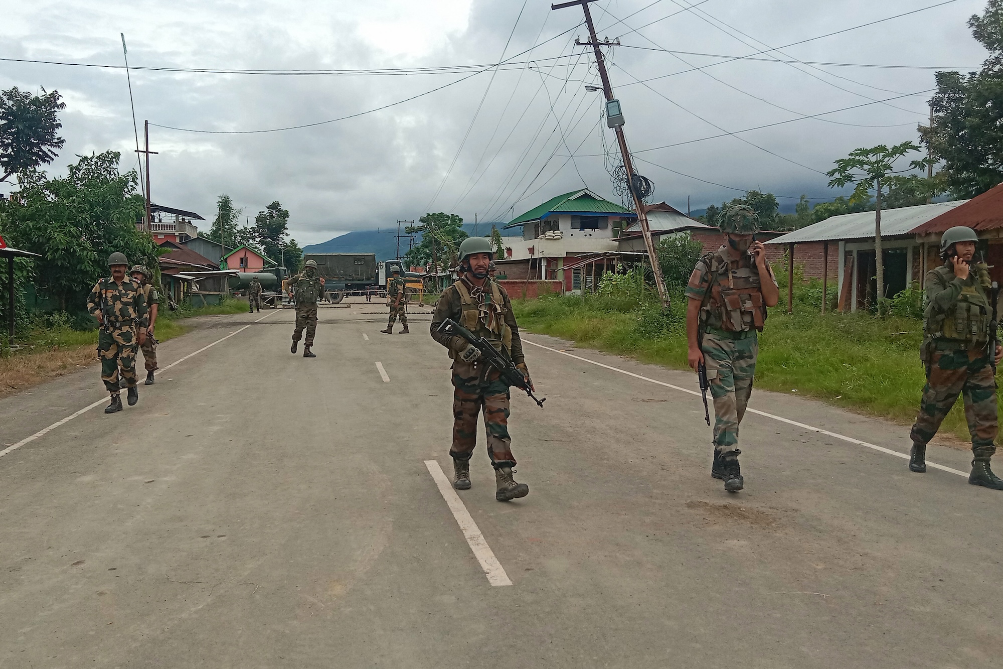 Indian security forces personnel stand guard in India's north-eastern Manipur state