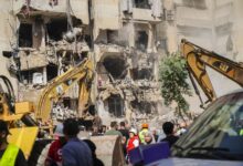 Rescuers sift through the rubble at the scene of an Israeli strike that targets Beirut's southern suburbs, as search and rescue operations continue in Beirut, Lebanon, on September 21, 2024