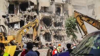 Rescuers sift through the rubble at the scene of an Israeli strike that targets Beirut's southern suburbs, as search and rescue operations continue in Beirut, Lebanon, on September 21, 2024