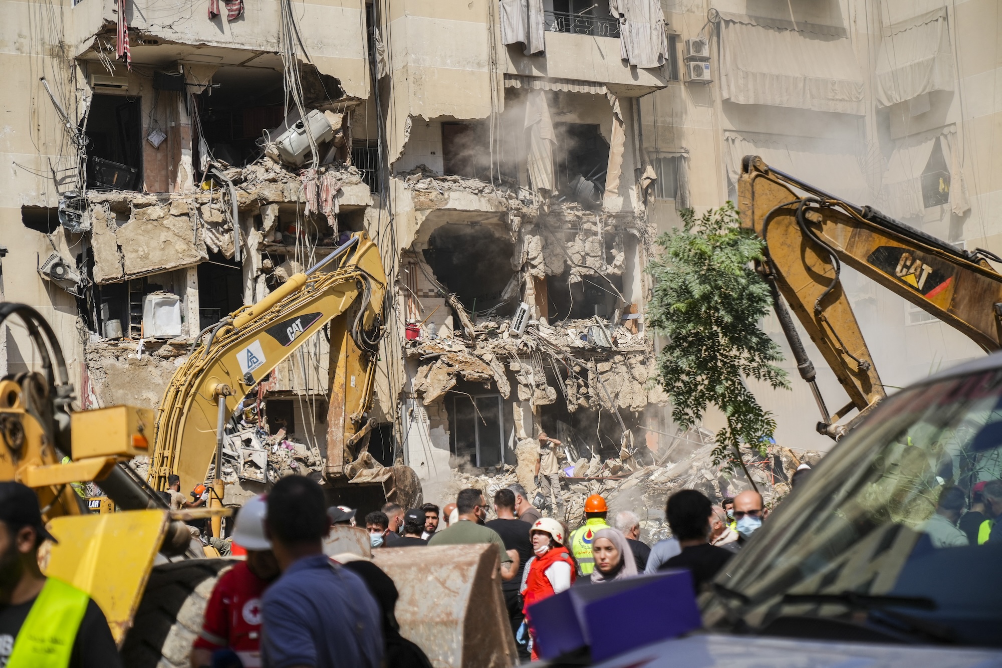 Rescuers sift through the rubble at the scene of an Israeli strike that targets Beirut's southern suburbs, as search and rescue operations continue in Beirut, Lebanon, on September 21, 2024