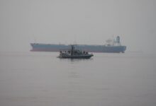 Marines assigned to Fleet Anti-Terrorism Security Team, Central Command (FASTCENT), approach the Arc Liberty, a Military Sealift Command time chartered vessel, in the Arabian Gulf to provide embarked security during a Strait of Hormuz transit.