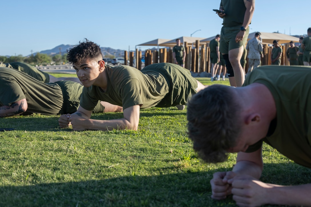 US Marines conduct the plank portion of a physical fitness test at Marine Corps Air-Ground Combat Center, Twentynine Palms, California