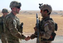 US Army Maj. Gen. visits with an Iraqi soldier at a tactical assembly area in northern Iraq prior to the start of the Mosul offensive