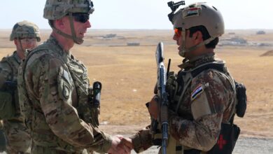 US Army Maj. Gen. visits with an Iraqi soldier at a tactical assembly area in northern Iraq prior to the start of the Mosul offensive