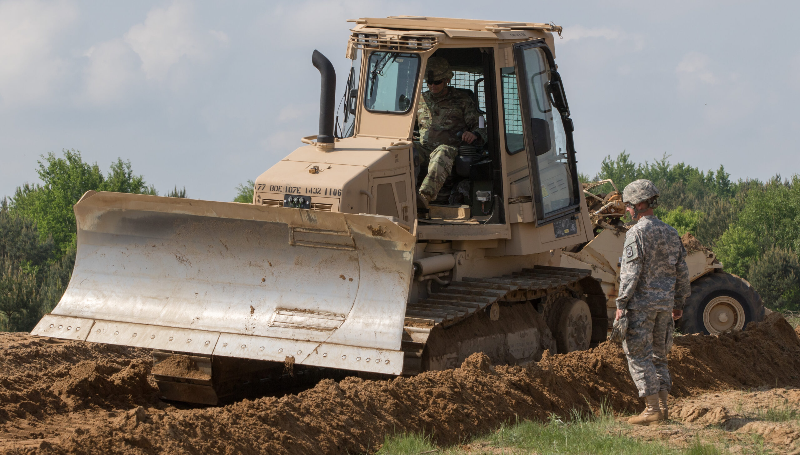 U.S. Soldiers from the 194th Engineer Brigade, Tennessee National Guard, perform horizontal construction training on various pieces of equipment while building foundations and roads during Resolute Castle 2018, at the Drawsko Pomorskie Training Area, Poland, May 12, 2018. Resolute Castle is a multinational training exercise for NATO and U.S. Army engineers, which supports Atlantic Resolve by promoting interoperability. Atlantic Resolve is a demonstration of the United States’ commitment to the collective security of Europe through the deployment of rotational U.S. forces in cooperation with NATO ally and partner nations. (U.S. Army photo by Spc. Andrew McNeil / 22nd Mobile Public Affairs Detachment)