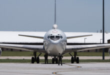 A U.S. Navy E-6B Mercury aircraft, assigned to Strategic Communications Wing 1 at Tinker Air Force Base, Oklahoma, receives post-flight maintenance after landing at Offutt AFB, Nebraska, July 15, 2019. In August 1989, the E-6A replaced the EC-130Q in the performance of the Navy's Take Charge and Move Out mission which links the National Command Authority with naval ballistic missile forces during times of crisis. The first E-6B aircraft was accepted in December 1997, and the E-6B assumed its dual operational mission in October 1998. The E-6 fleet was completely modified to the E-6B configuration in 2003. (U.S. Air Force photo by Staff Sgt. Jacob Skovo)