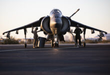 U.S. Marines with Marine Aviation Weapons and Tactics Squadron One (MAWTS-1) refuel an AV-8B Harrier II Plus aircraft during Weapons and Tactics Instructor (WTI) course 1-20 at Laguna Army Airfield in Yuma Proving Ground, Arizona, Oct. 7, 2019. WTI is a seven-week training event hosted by MAWTS-1, which emphasizes operational integration of the six functions of Marine Corps aviation in support of a Marine Air Ground Task Force. WTI also provides standardized advanced tactical training and certification of unit instructor qualifications to support Marine aviation training and readiness, and assists in developing and employing aviation weapons and tactics. (U.S. Marine Corps photo by Cpl. Lauren Brune)