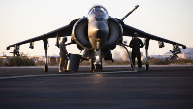 U.S. Marines with Marine Aviation Weapons and Tactics Squadron One (MAWTS-1) refuel an AV-8B Harrier II Plus aircraft during Weapons and Tactics Instructor (WTI) course 1-20 at Laguna Army Airfield in Yuma Proving Ground, Arizona, Oct. 7, 2019. WTI is a seven-week training event hosted by MAWTS-1, which emphasizes operational integration of the six functions of Marine Corps aviation in support of a Marine Air Ground Task Force. WTI also provides standardized advanced tactical training and certification of unit instructor qualifications to support Marine aviation training and readiness, and assists in developing and employing aviation weapons and tactics. (U.S. Marine Corps photo by Cpl. Lauren Brune)