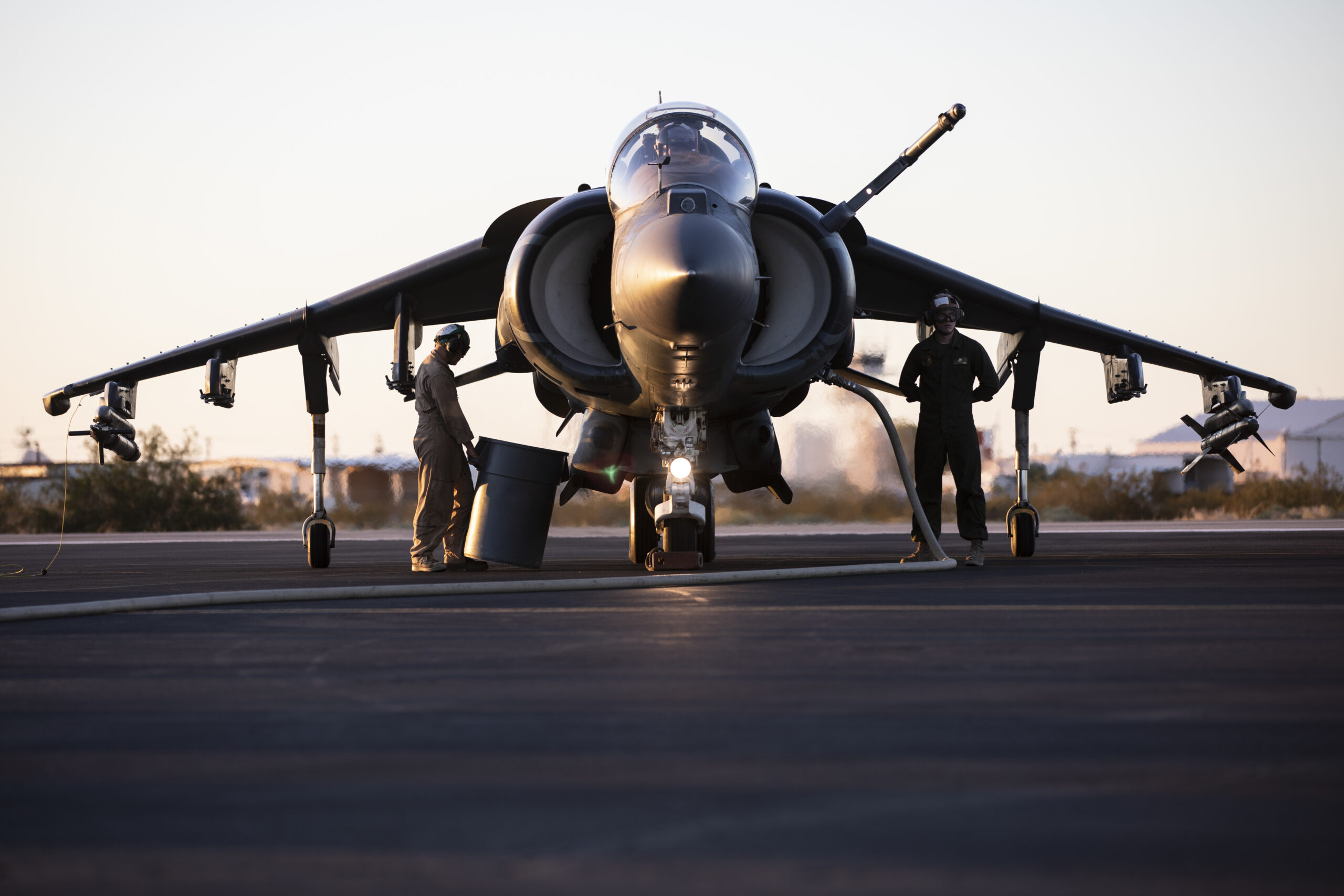 U.S. Marines with Marine Aviation Weapons and Tactics Squadron One (MAWTS-1) refuel an AV-8B Harrier II Plus aircraft during Weapons and Tactics Instructor (WTI) course 1-20 at Laguna Army Airfield in Yuma Proving Ground, Arizona, Oct. 7, 2019. WTI is a seven-week training event hosted by MAWTS-1, which emphasizes operational integration of the six functions of Marine Corps aviation in support of a Marine Air Ground Task Force. WTI also provides standardized advanced tactical training and certification of unit instructor qualifications to support Marine aviation training and readiness, and assists in developing and employing aviation weapons and tactics. (U.S. Marine Corps photo by Cpl. Lauren Brune)