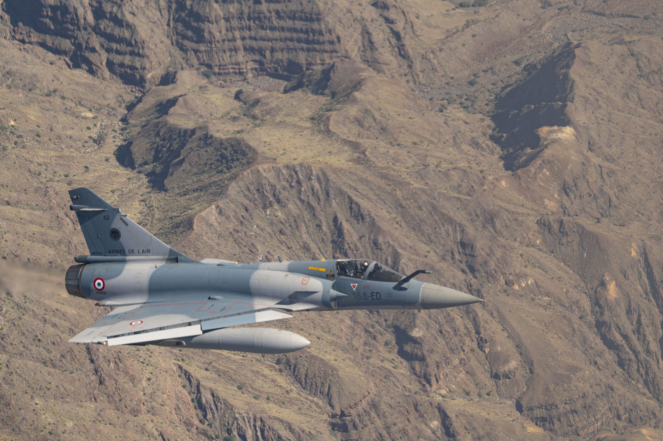 A French Air Force Mirage 2000 conducts training with U.S. Marines assigned to Marine Medium Tiltrotor Squadron 364 (VMM-364) over Djibouti, May 22, 2023. The U.S. marines partnered with the French Air Force to conduct defensive combat maneuver training to showcase and expand upon joint capabilities in order to build a more capable and cohesive force. (U.S. Air Force photo by Staff Sgt. Aaron Irvin)