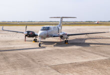 A T-54 multi-engine aircraft sits on the flightline of Naval Air Station (NAS) Corpus Christi, April 18. The arrival of the T-54A heralds a new generation of Naval Aviators who will use the trainer to earn their wings of gold as they prepare to fly such aircraft as the P-8A Poseidon, E-2D Hawkeye, and C-130 Herculese. The T-54A recplaces the T-44C Pegasus, an aircraft that has been in naval service since 1977. (U.S. Navy Photo by Anne Owens/Released)