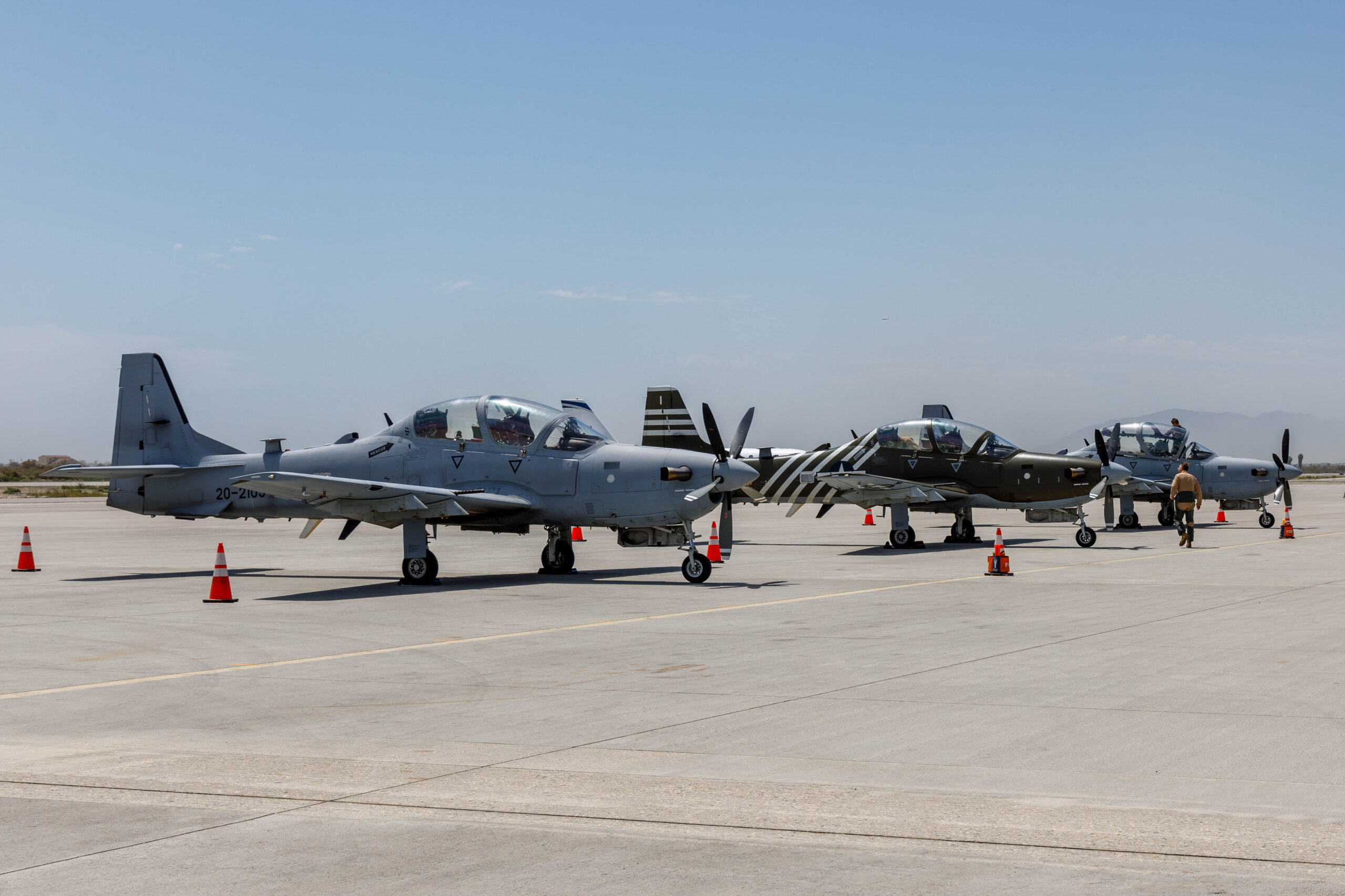 Three A-29 Super Tucanos prepare for a ferry flight to Edwards Air Force Base, California, July 18, where they will join a unique fleet at the U.S. Air Force Test Pilot School. (Air Force photo by Richard Gonzales)