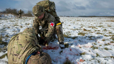 3 Medical Regiment Role 1 validation training Army medics have been training to give life-saving care – even under fire. Full-time Regulars and spare-time Reservists, including those of Preston-based 3 Medical Regiment, have this week been tested on the frozen North Luffenham training area in the Midlands. A battlefield environment was simulated using blank ammunition and actors, but Combat Medical Technicians know that one day they might be asked to do it for real. The ‘care under fire’ scenario is designed to see how medics will react while attending to a casualty under a hail of bullets. Soldiers must apply immediate first aid and carry the wounded, including the casualty’s 40kg of kit, whilst others provide covering fire. Extra tests staged during the training examined their ability to treat conditions as varied as chest infections and gunshot wounds, all from nothing more than a tent. Once completed, the exercise qualifies the Army Medical Services’ first responders to fulfil their role anywhere in the world. Photographer: Sergeant Donald Todd (RLC) / MoD Crown Copyright read less