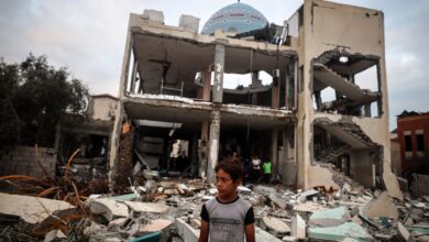 A Palestinian inspects the damage to a mosque after it is hit in an Israeli strike in Deir al-Balah, central Gaza Strip, on October 6, 2024