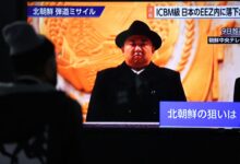 A screen monitor shows North Korean leader Kim Jong Un