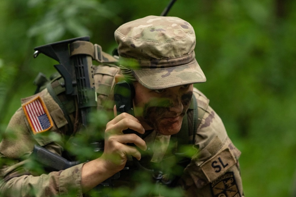 Cadet coordinates an attack plan through his Field Radio Backpack during a Field Training Exercise at Fort Knox