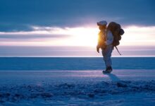 A soldier walks on frozen land near Utqiagvik, Alaska as part of Joint Pacific Multinational Readiness Training Center 24-02, February, 2024