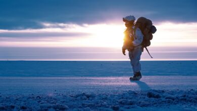 A soldier walks on frozen land near Utqiagvik, Alaska as part of Joint Pacific Multinational Readiness Training Center 24-02, February, 2024