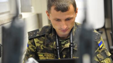 A member of the Ukraine military monitors and maintain network access during an exercise