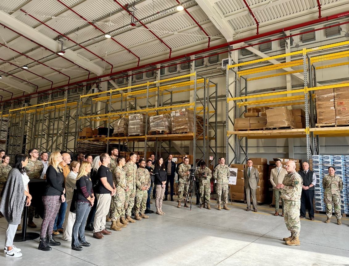 Soldiers, Airmen, U.S. and Italian civilian employees listen as U.S. Army Gen. Christopher Cavoli, commander, U.S. European Command & Supreme Allied Commander explains the importance of the new warehouse during an Oct. 9 event at Aviano Air Base. (Scavetta, Richard (Rick) A., CIV USARMY IMCOM EUROPE (US))