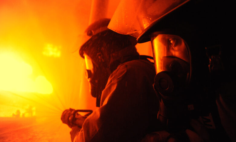 CAPE MAY, N.J. - Coast Guard recruits from Company Zulu 186 man a fire hose during firefighting training aboard Training Center Cape May Aug. 1, 2012.Shipboard fires are a enduring threat to any mariner, so every recruit learns the basics of shipboard firefighting prior to graduation. Coast Guard photo by Chief Warrant Officer Donnie Brzuska.