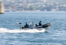 A rigid hull inflatable boat moves to the action scene during the NCIS filming in Sydney Harbour, NSW. *** Local Caption *** Navy people, ships and aircraft add authenticity and action to NCIS: Sydney, the first international edition of the highly successful US television series. The series premiers in Australia on 10 November and in the United States on 13 November. For Navy, NCIS: Sydney is an opportunity to amplify Navys current recruiting campaign to attract more talented men and women to join for a meaningful career option.