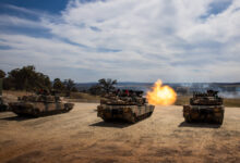 Australian Army Abrams M1A2 SEPv3 Main Battle Tanks during a live-fire serial as part of a qualification course for Royal Australian Armoured Corps soldiers at Puckapunyal Military Area, Victoria. *** Local Caption *** Armys combined arms fighting system will be modernised through the delivery of LAND 907. LAND 907 will deliver M1A2 Abrams System Enhancement Package version 3 (SEPv3) main battle tanks (MBTs). LAND 907 will also deliver the assault breacher vehicle (ABV) and joint assault bridge (JAB) collectively known as the combat engineering vehicles (CEV). The MBT and CEV are manufactured in the United States of America in Alabama, Ohio and Missouri before being shipped to Australia from Southern California. The initial block of MBT, comprising 27 vehicles, departed the US in late June and arrived in Australia in August 2024. The initial block of CEV will also be shipped to Australia, arriving in early 2025. The MBT and CEV will be located in Townsville as part of the 2nd Cavalry Regiment, 3rd Brigade, with small fleets located in Puckapunyal and Wodonga, in accordance with the outcomes of the 2024 National Defence Strategy.