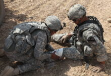 A U.S. Army soldier, 4th Squadron, 9th Cavalry Regiment, 2nd Brigade, 1st Cavalry Division, applies combat gauze to a fellow soldier's leg as part of medical exercises at Forward Operating Base Cobra in the Diyala province, Iraq, July 12. The soldiers are practicing combat lifesaver drills as well as evacuating a casualty out of a hostile environment. (U.S. Army photo by Pfc. Nikko-Angelo Matos)