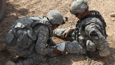 A U.S. Army soldier, 4th Squadron, 9th Cavalry Regiment, 2nd Brigade, 1st Cavalry Division, applies combat gauze to a fellow soldier's leg as part of medical exercises at Forward Operating Base Cobra in the Diyala province, Iraq, July 12. The soldiers are practicing combat lifesaver drills as well as evacuating a casualty out of a hostile environment. (U.S. Army photo by Pfc. Nikko-Angelo Matos)