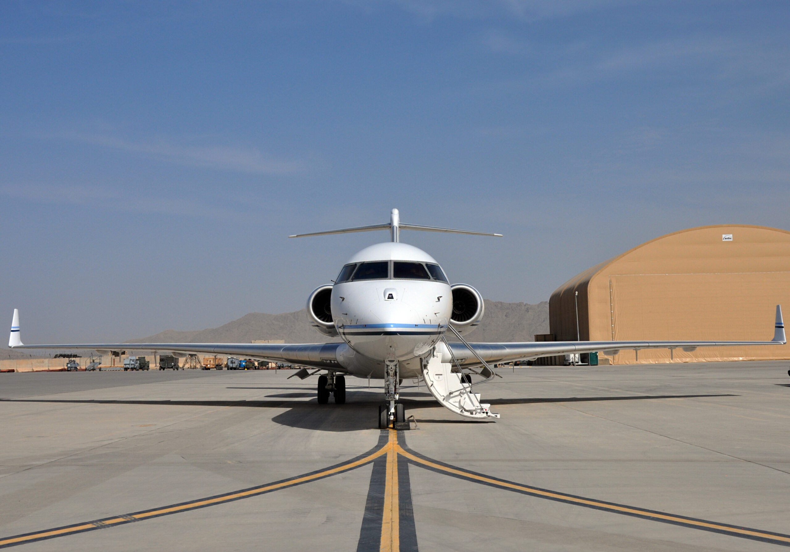 An E-11A aircraft outfitted with a Battlefield Airborne Communications Node from the 430th Expeditionary Electronic Combat Squadron sits on the runway at Kandahar Airfield, Afghanistan, April 4, 2019. The region’s difficult terrain poses threats to troop’s communication efforts, and the BACN helps keep them connected. (U.S. Air Force photo by Capt. Anna-Marie Wyant)