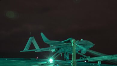 Aerosonde Unmanned Arial Surveillance (UAS) vehicle, Buck G, awaits to launch aboard the Expeditionary Sea-Base USS Hershel “Woody” Williams (ESB 4) in the Atlantic Ocean, Sept. 25, 2020. The UAS is piloted by Aerosonde personnel from the Hershel “Woody” Williams and provides live aerial surveillance to enhance the ship’s security. Hershel “Woody” Williams is on its inaugural deployment in the U.S. Naval Forces Europe-Africa area of responsibility in support of maritime missions and special operations. (U.S. Marine Corps photo by Sgt. Megan Roses/Released)