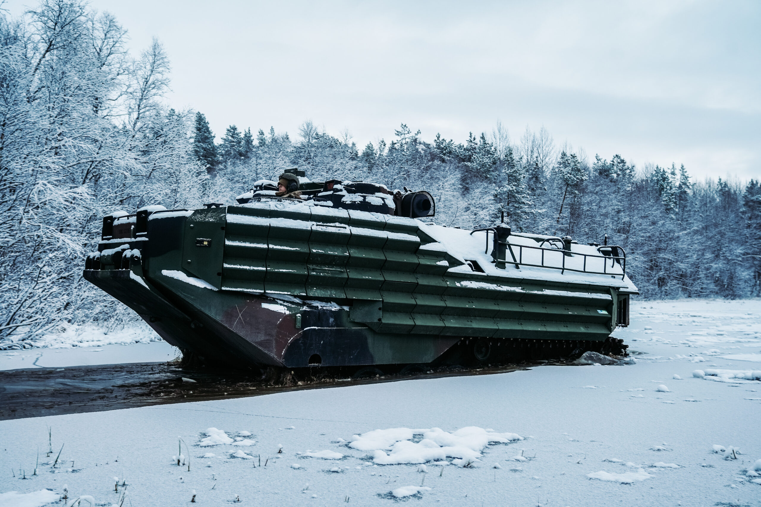 U.S. Marines with Marine Rotational Force-Europe 21.1, Marine Forces Europe and Africa, conduct a safety of use memorandum (SOUM) on an assault amphibious vehicle in preparation for Exercise Reindeer II, Reindeer I, and Joint Viking in Setermoen, Norway, Nov. 19, 2020. The SOUM test assessed the watertight integrity of AAV’s hull on a submerged ramp and is part of a continuing effort to ensure the equipment is safe. (U.S. Marine Corps photo by Cpl. William Chockey)