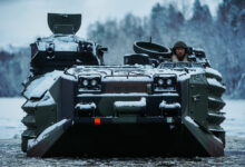 U.S. Marines with Marine Rotational Force-Europe 21.1, Marine Forces Europe and Africa, conduct a safety of use memorandum (SOUM) on an assault amphibious vehicle (AAV) in preparation for Exercise Reindeer II, Reindeer I, and Joint Viking in Setermoen, Norway, Nov. 19, 2020. The SOUM test assessed the watertight integrity of AAV’s hull on a submerged ramp and is part of a continuing effort to ensure the equipment is safe. (U.S. Marine Corps photo by Cpl. William Chockey)