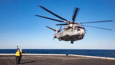 Aviation Boatswain’s Mate (Handling) Airman Victor Vazquez Ramos, assigned to the San Antonio-class amphibious transport dock ship USS Arlington (LPD 24), launches a Sikorsky CH-53K King Stallion helicopter from Arlington’s flight deck, Feb. 14, 2023. The King Stallion is a heavy-lift cargo helicopter undergoing sea trials as the next evolution of the CH-53 series helicopters that have been in service since 1966. (U.S. Navy photo by Mass Communication Specialist 1st Class John Bellino)