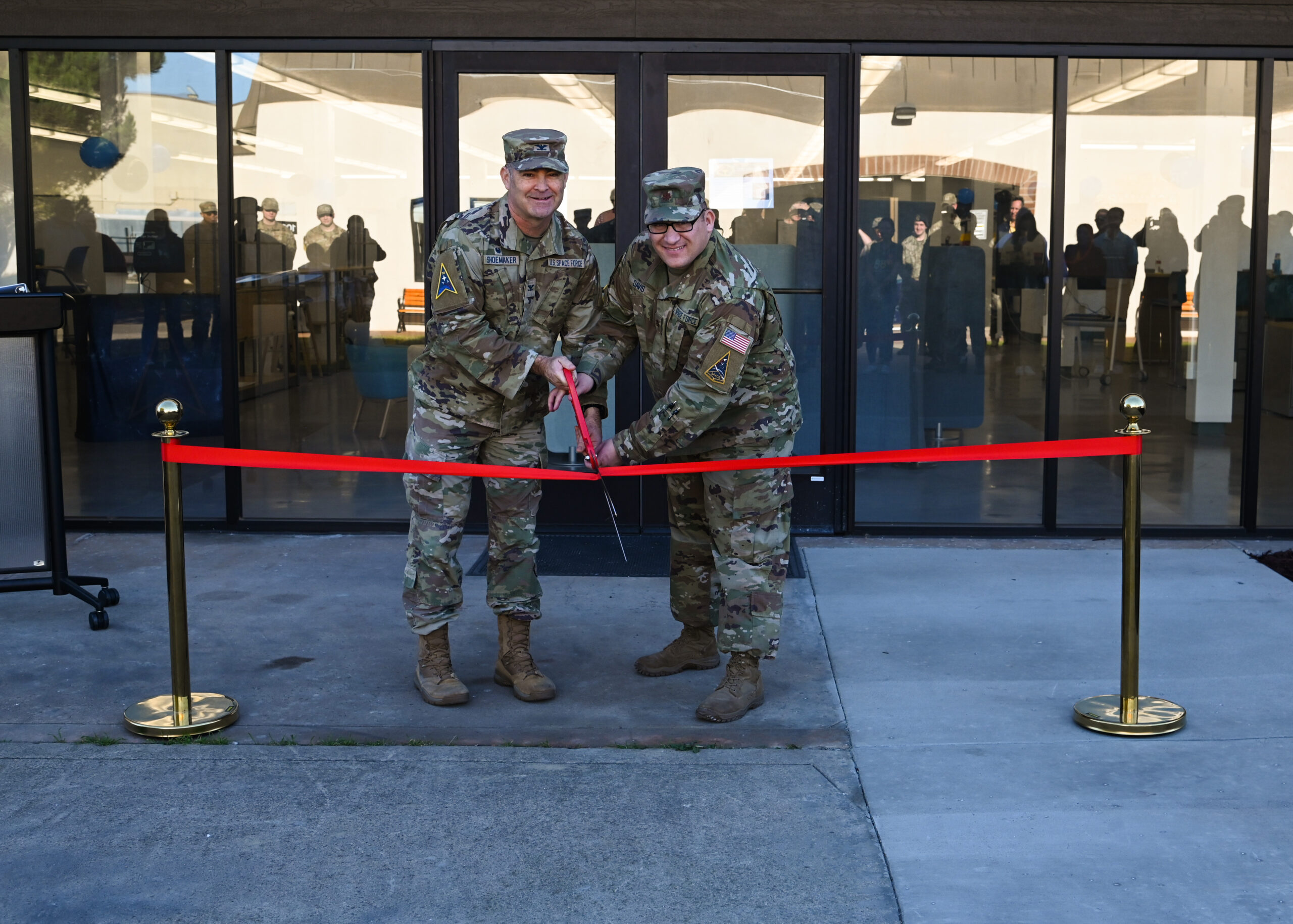 U.S. Space Force Col. Mark Shoemaker, Space Launch Delta 30 commander, and U.S. Space Force Maj. Bryan L. Davis, SLD 30 spaceport innovation chief, participate in a ribbon cutting ceremony for the opening of The Crucible Innovation Lab at Vandenberg Space Force Base, Calif., Nov. 22, 2024. The Crucible is a new innovation center that offers people the tools, resources, and space needed to turn their concepts into a reality. (U.S. Space Force photo by Senior Airman Kadielle Shaw)