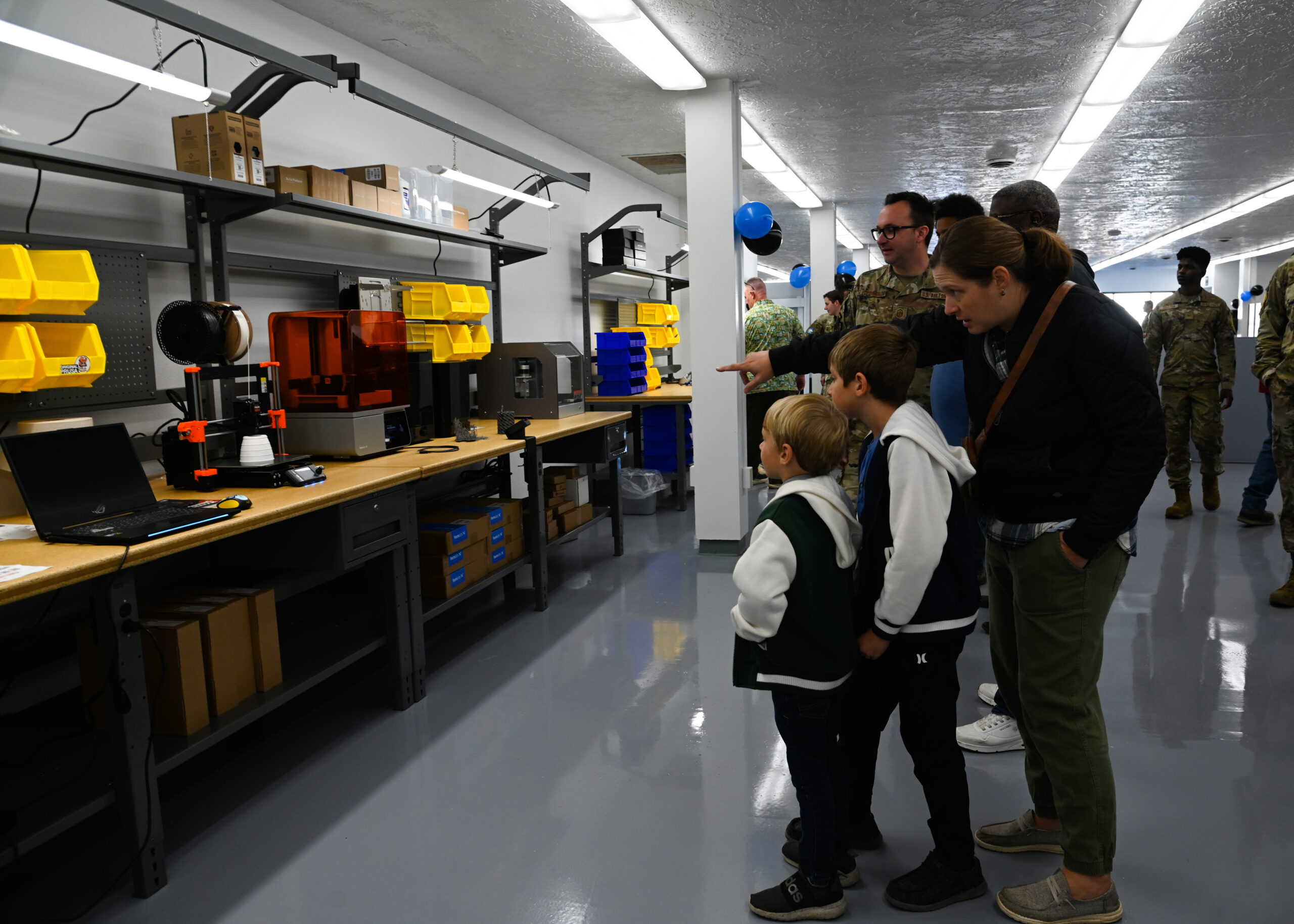 Base members explore The Crucible Innovation Lab at its opening ceremony at Vandenberg Space Force Base, Calif., Nov. 22, 2024. This new makerspace is designed to be a collaborative environment where Vandenberg members can come together to brainstorm, innovate, and bring ideas to life. (U.S. Space Force photo by Senior Airman Kadielle Shaw)