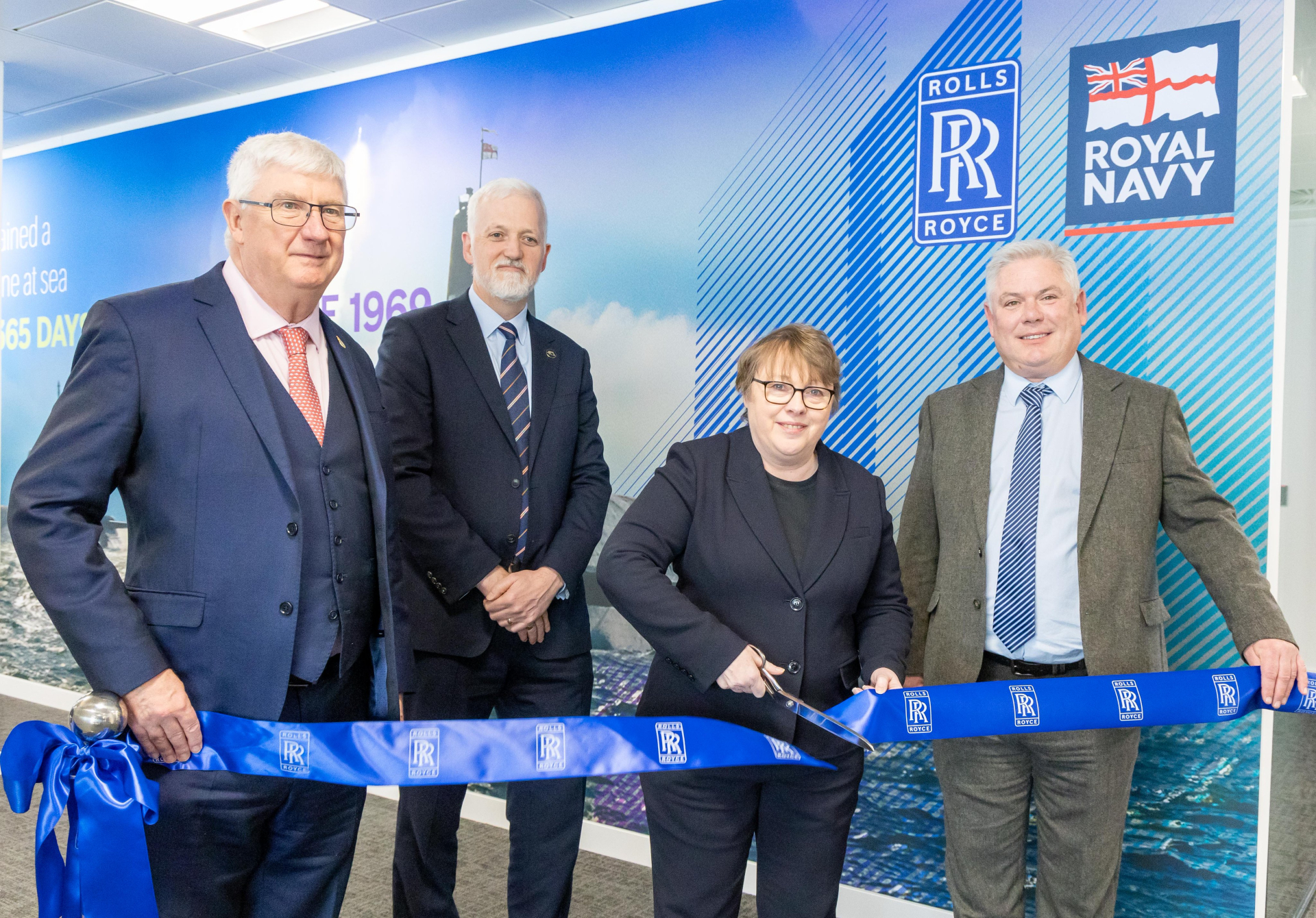 Rolls-Royce and UK Ministry of Defence leaders cut ribbon of a a submarine support office in Glasgow