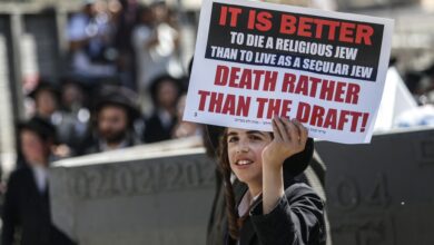 Israeli police officers intervene in Ultra-Orthodox Jews who gather to stage a protest against mandatory military service in West Jerusalem, Israel, on August 21, 2024