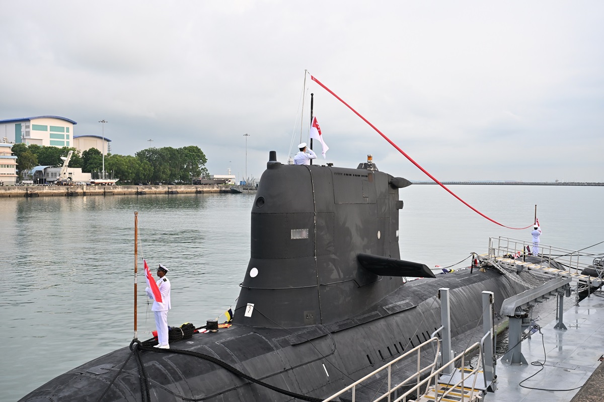 The decommissioning pennant of RSS Chieftain being lowered.