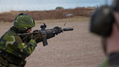 Soldier firing a Sako Automatkarbin 24 (AK 24) assault rifle