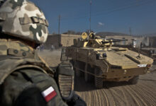 A Polish soldier pulls rear security on a Rosomak vehicle while on patrol in the city of Ghazni, Afghanistan, Nov. 18. (U.S. Army photo by Sgt. Justin Howe)