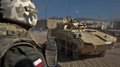 A Polish soldier pulls rear security on a Rosomak vehicle while on patrol in the city of Ghazni, Afghanistan, Nov. 18. (U.S. Army photo by Sgt. Justin Howe)