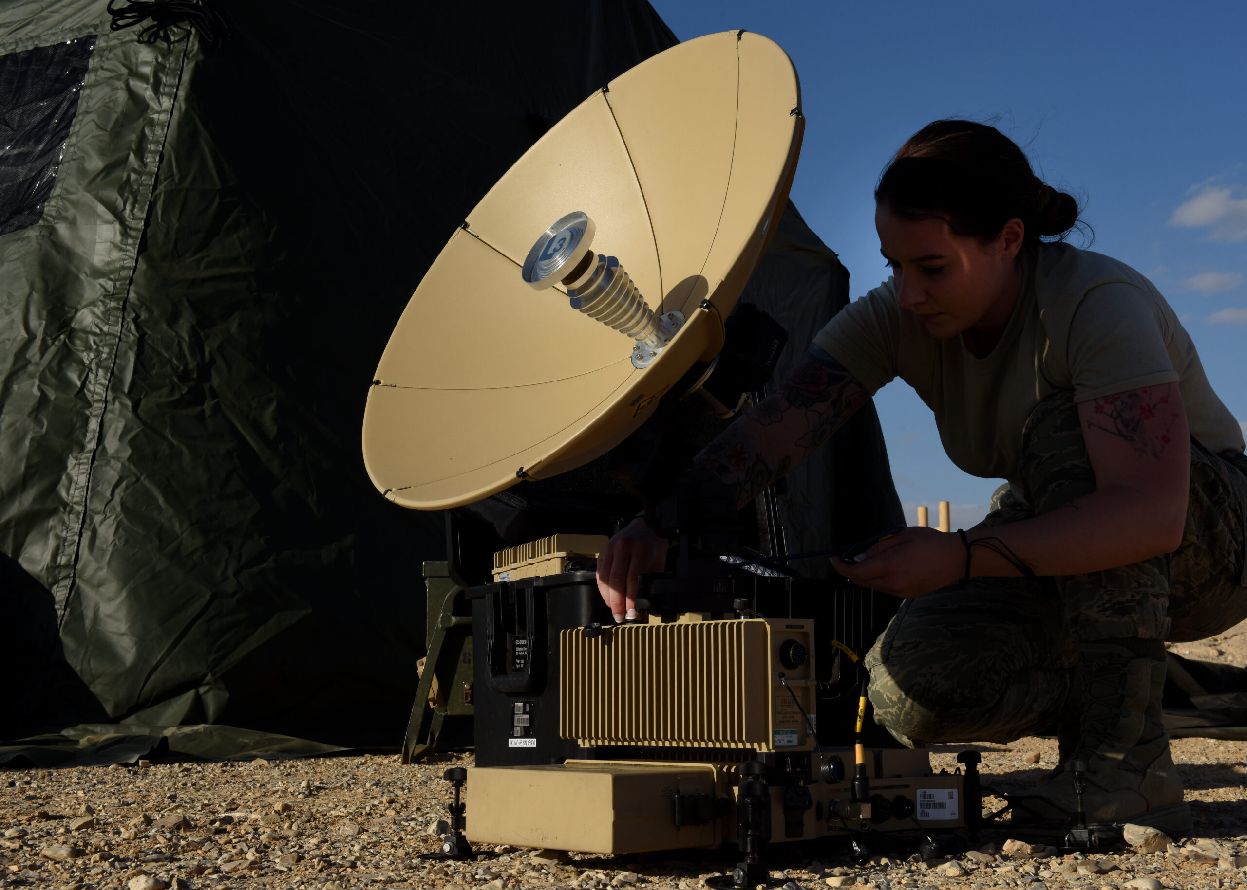 Senior Airman Elizabeth Arthur, 1st Combat Communications Squadron radio frequency transmission systems technician, sets up a Panther satellite communications terminal at Uvda Air Force Base, Israel, Oct. 30, in support of Blue Flag 17. The U.S. and Israel share a strong and long-lasting relationship in addition to a close military partnership, and exercises like this further strengthen the relationship of our nations and promote regional peace and stability. (U.S. Air Force photo/Senior Airman Abby L. Finkel)