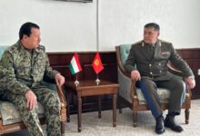 Tajikistan's Saimumin Yatimov and Kyrgyzstan's Kamchybek Tashiev at a border demarcation deal