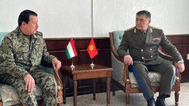 Tajikistan's Saimumin Yatimov and Kyrgyzstan's Kamchybek Tashiev at a border demarcation deal