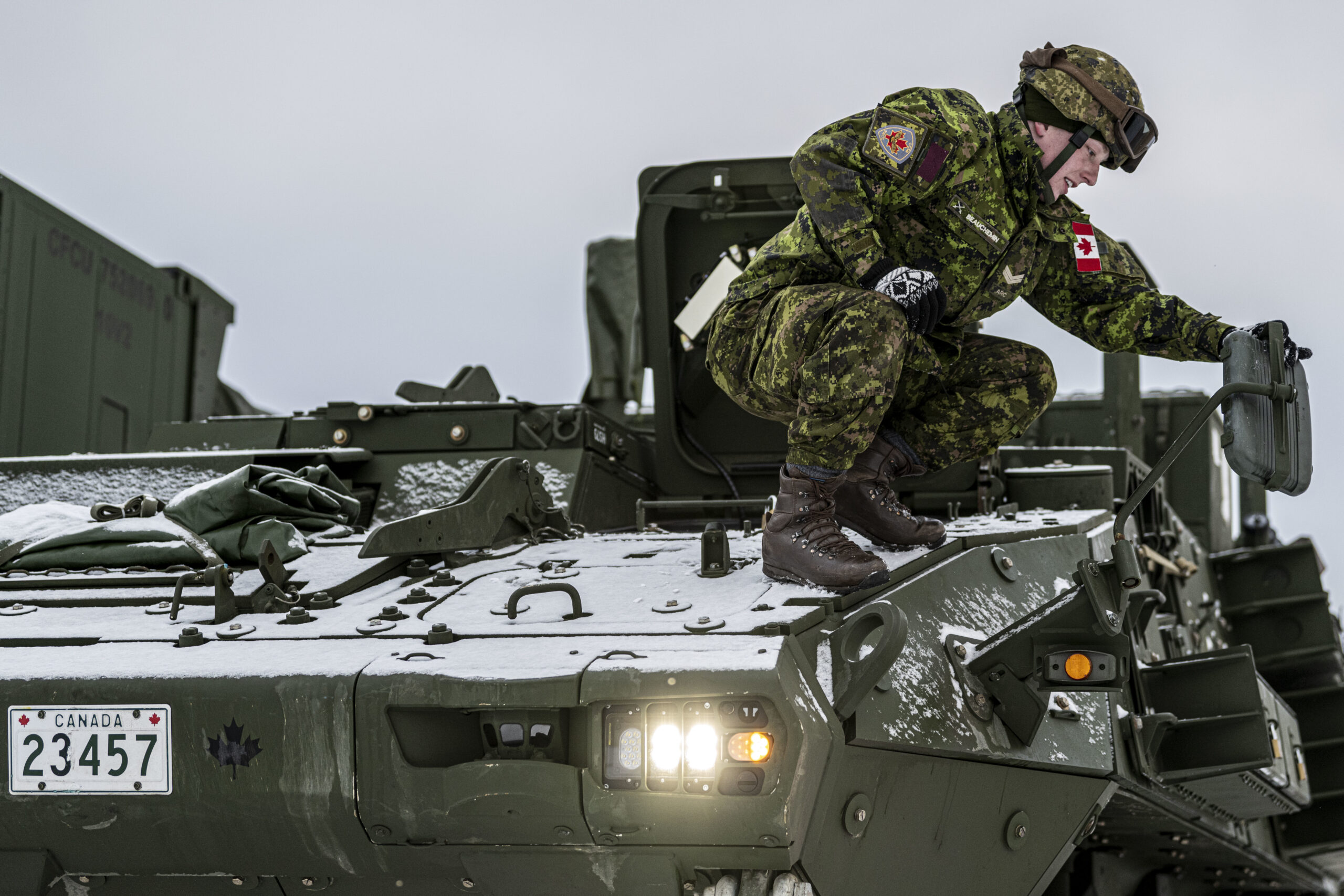 Canadian Army Bombardier Brett Beauchemin, an airspace coordination centre technician assigned to 4th Artillery Regiment, positions a side-view mirror on a light armoured vehicle during Exercise ARCTIC EDGE 2022 at Eielson Air Force Base, Alaska, Mar. 6, 2022. Arctic Edge is the largest joint exercise in Alaska, with approximately 1,000 U.S. military personnel training alongside members of the Canadian Armed Forces. (U.S. Air Force photo by Senior Airman Joseph P. LeVeille)