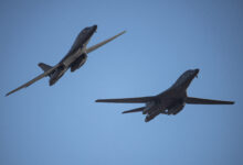 Two U.S. Air Force B-1B Lancers assigned to the 34th Expeditionary Bomb Squadron, Ellsworth Air Force Base, South Dakota, fly by Royal Australian Air Force Base Darwin, Northern Territory, Australia, before landing for fuel on June 22, 2022. Bomber Task Force missions contribute to joint force lethality and deter aggression in the Indo-Pacific by demonstrating United States Air Force ability to operate anywhere in the world at any time in support of the National Defense Strategy. (U.S. Air Force Photo by Tech.Sgt. Chris Hibben)